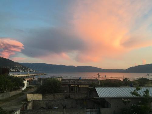 a view of a body of water with a sunset at Vila Isufaj in Vlorë