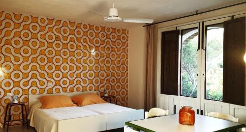 Ein Bett oder Betten in einem Zimmer der Unterkunft Dammusi A- Mare Pantelleria