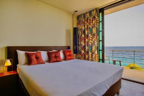 Cama ou camas em um quarto em Pietermaai Boutique Hotel