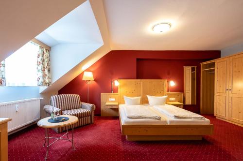 Postel nebo postele na pokoji v ubytování Hotel Vollmann
