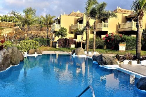 a swimming pool in front of a house at Holiday home Los Frailes in Puerto de la Cruz