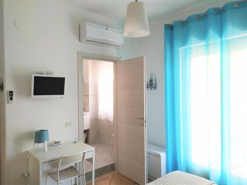 TV a/nebo společenská místnost v ubytování B&B Pizzomunno