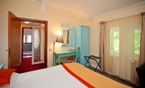 Postel nebo postele na pokoji v ubytování Hotel Bastion
