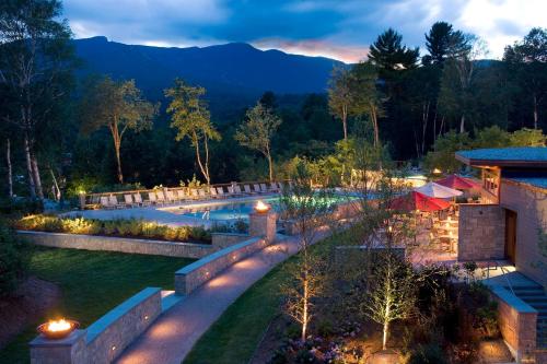 an aerial view of a resort with a pool at night at Topnotch Resort in Stowe