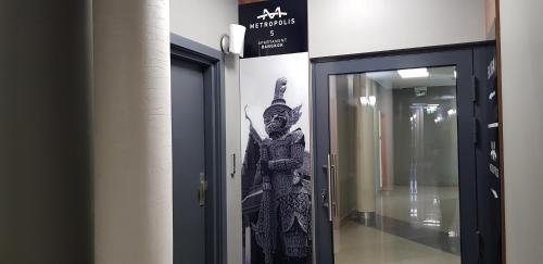 a picture of a statue in a building at Metropolis Apartamenty Centrum in Kalisz