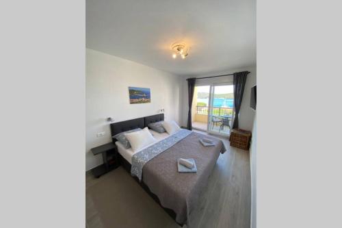 Posteľ alebo postele v izbe v ubytovaní A lovely and cozy room with a breathtaking view 2