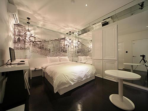 Cama ou camas em um quarto em Sinchon Hotel GAEUL