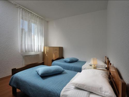 Postel nebo postele na pokoji v ubytování Apartment Vita