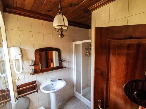 a bathroom with a sink and a mirror at Casa Carolina in Vila Seca