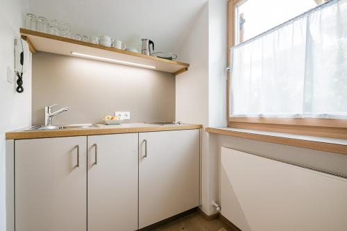 Una cocina o zona de cocina en Appartements Sporting