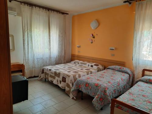 En eller flere senger på et rom på Hotel Vittoria