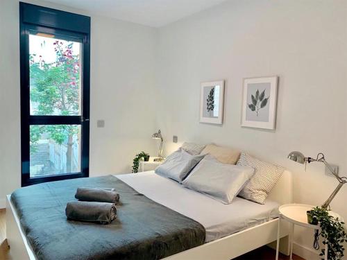 Postel nebo postele na pokoji v ubytování Elegant Beach Flat