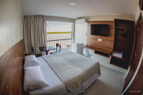 Ένα ή περισσότερα κρεβάτια σε δωμάτιο στο Hotel Orla do Rio Branco