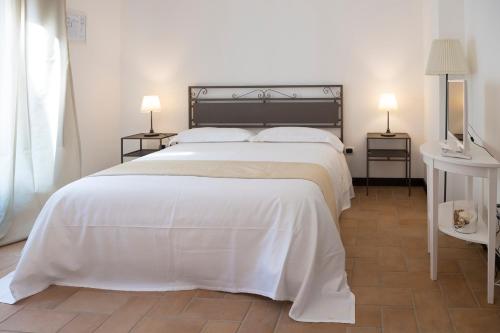 Postel nebo postele na pokoji v ubytování Domus Giuliae