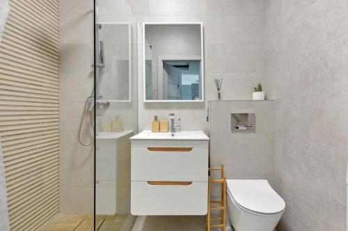 Ванная комната в Wave Apartments - Zajezdnia Wrzeszcz 2