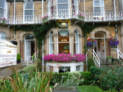 a building with flowers in front of it at Mansion House in Scarborough