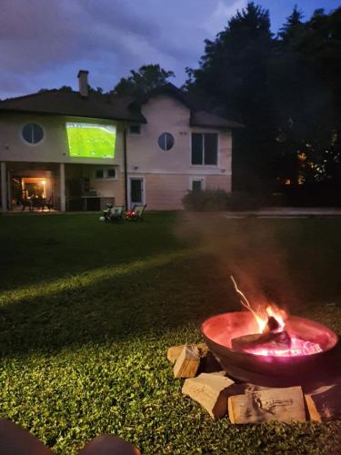 a fire in a bowl in a yard at night at Great Lane house in Sarajevo