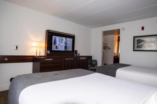 Postel nebo postele na pokoji v ubytování Crosswinds Motel