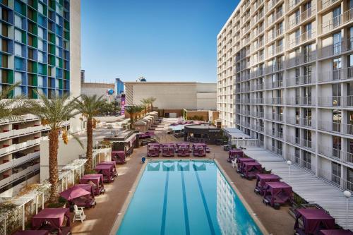 an aerial view of a hotel pool with chairs and tables at Harrah's Las Vegas Hotel & Casino in Las Vegas