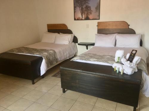 Кровать или кровати в номере Regis Hotel Boutique