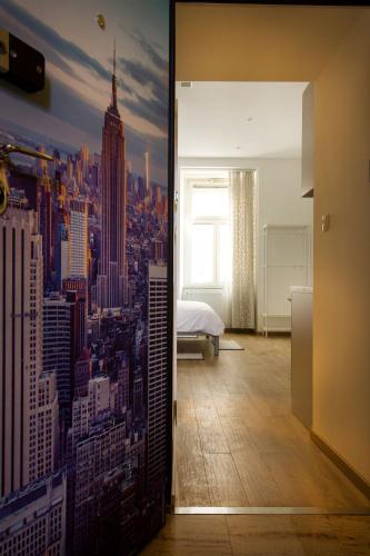 a bedroom with a mural of a city at Metropolis Apartments in Zagreb