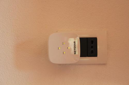 a switch on a wall with a light on it at Villa Antonella in Villasimius