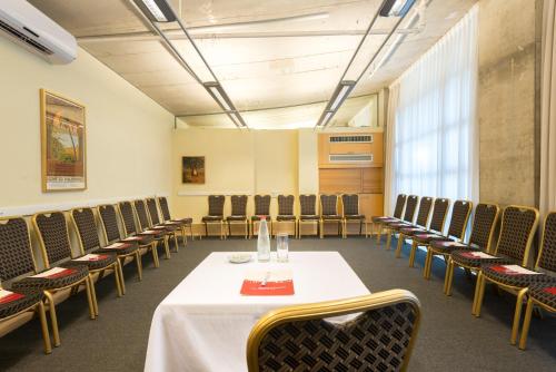 a conference room with a table and chairs at Ruth Daniel Residence in Tel Aviv