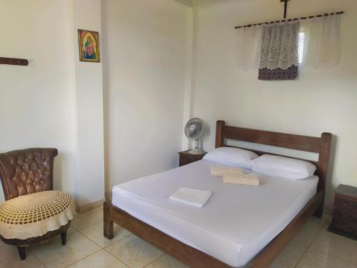 Giường trong phòng chung tại Hospedaria Villa Mariana
