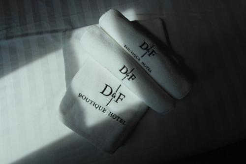 a close up of a remote control on a table at D&F BOUTIQUE HOTEL SEREMBAN 2 in Seremban