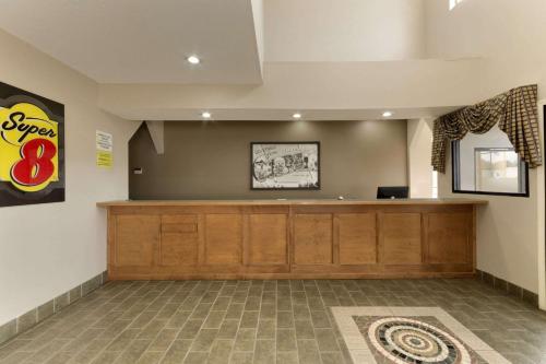 a waiting room with a cash counter in a building at Super 8 by Wyndham Chatsworth/Dalton in Chatsworth
