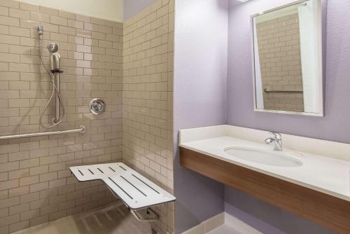 a bathroom with a sink and a shower at Microtel Inn & Suites by Wyndham Cadiz in Cadiz