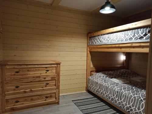 a bedroom with two bunk beds and a dresser at Brand NEW 2020 specious apartments DRUZI 3 in Bukovel
