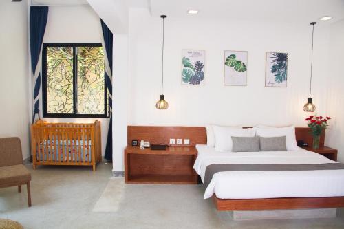 Кровать или кровати в номере Bopha Bassac Boutique Hotel