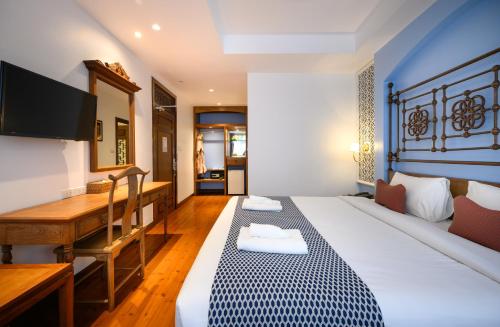 เตียงในห้องที่ WOO Gallery & Boutique hotel