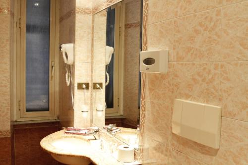 Koupelna v ubytování Hotel Genio