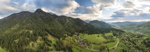an aerial view of a green mountain with trees at Apartmány pod Rozsutcom - Zaťkov dvor in Terchová