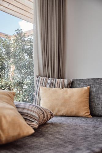 Ένα ή περισσότερα κρεβάτια σε δωμάτιο στο Haller Suites & Restaurant