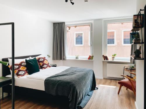 Ένα ή περισσότερα κρεβάτια σε δωμάτιο στο Lorenz Apartments