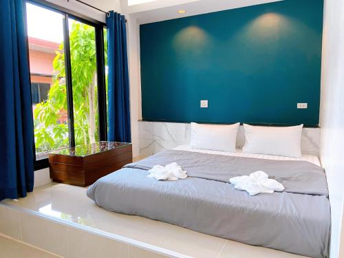 Postel nebo postele na pokoji v ubytování Petchngam Home Resort