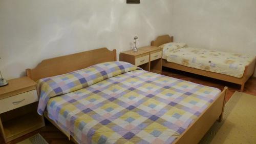 Postelja oz. postelje v sobi nastanitve Apartments Libera