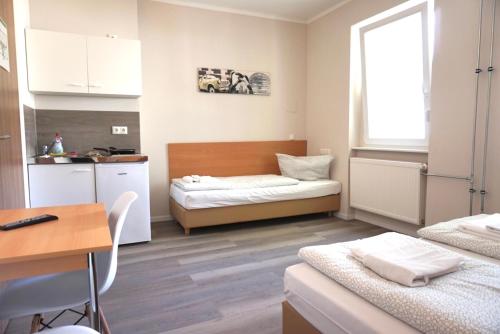 Ліжко або ліжка в номері Apartment Hotel Wittenau