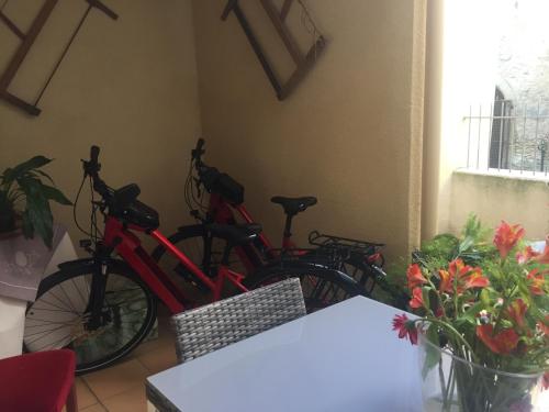 a group of bikes parked in a room at Chambre d hote de charme avec plein d authenticité du 13 ème siècle in Châteauneuf-du-Pape