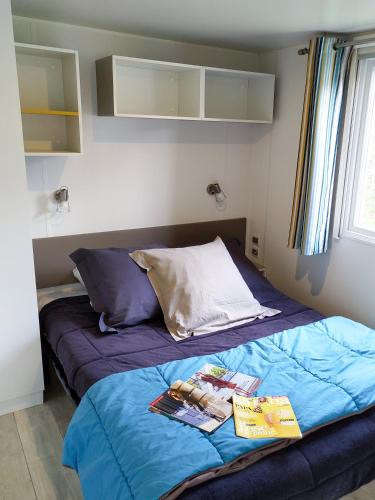 Postel nebo postele na pokoji v ubytování Camping TIKITI