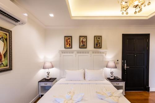 Ένα ή περισσότερα κρεβάτια σε δωμάτιο στο Merchant Villa- SHA Extra Plus