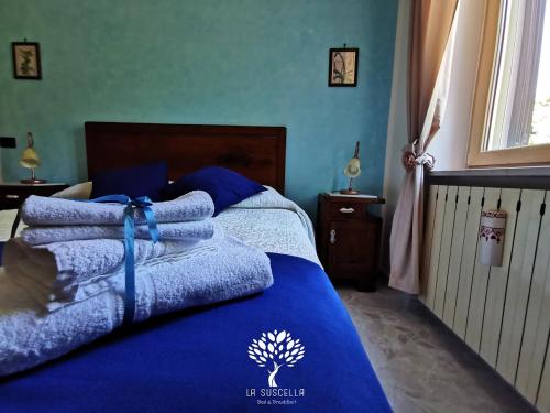 Letto o letti in una camera di La Suscella Bed & Breakfast
