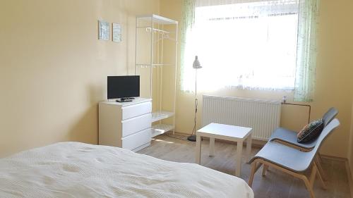 TV a/nebo společenská místnost v ubytování Apartment Arnika