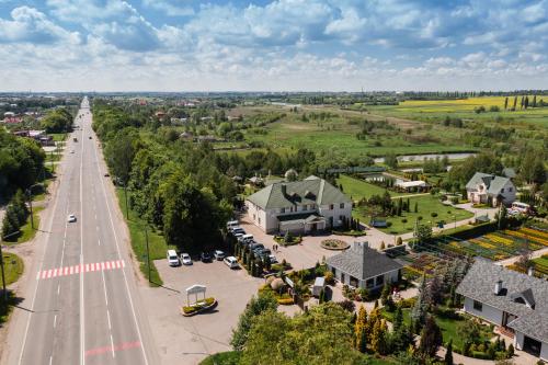 an aerial view of a town with a road and houses at Рестпарк рекреаційний комплекс in Luts'k