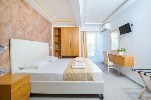 Ein Bett oder Betten in einem Zimmer der Unterkunft Versa Studios
