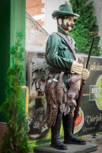 a statue of a man in uniform holding a rifle at Hubert Varga in Komárno