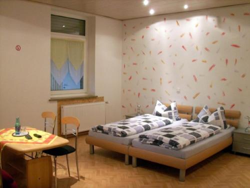 Ένα ή περισσότερα κρεβάτια σε δωμάτιο στο Ferienhof & Café Schnieder